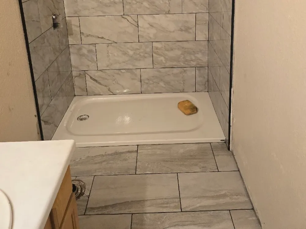 New tiled shower surround by Sua's Handyman Services in San Antonio, TX